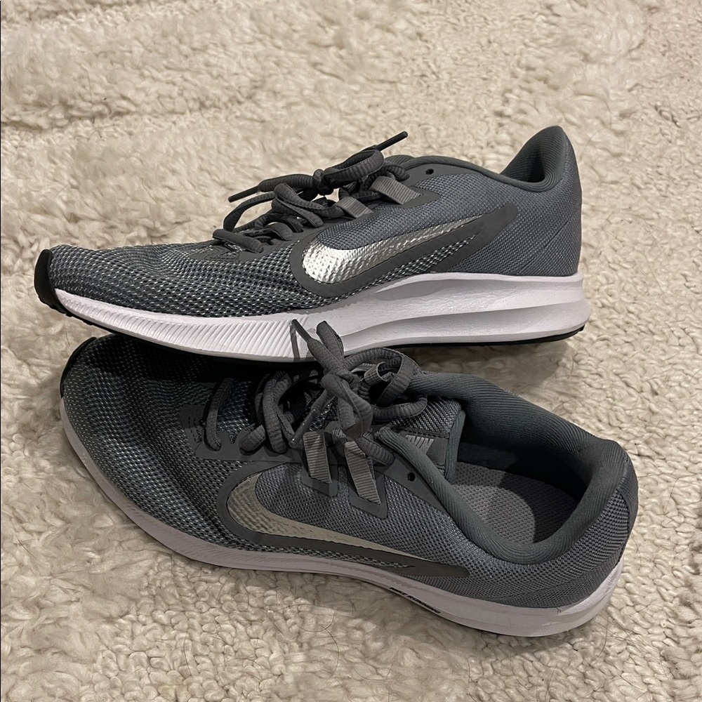 New never worn Nike Charcoal and Metallic running Sneakers